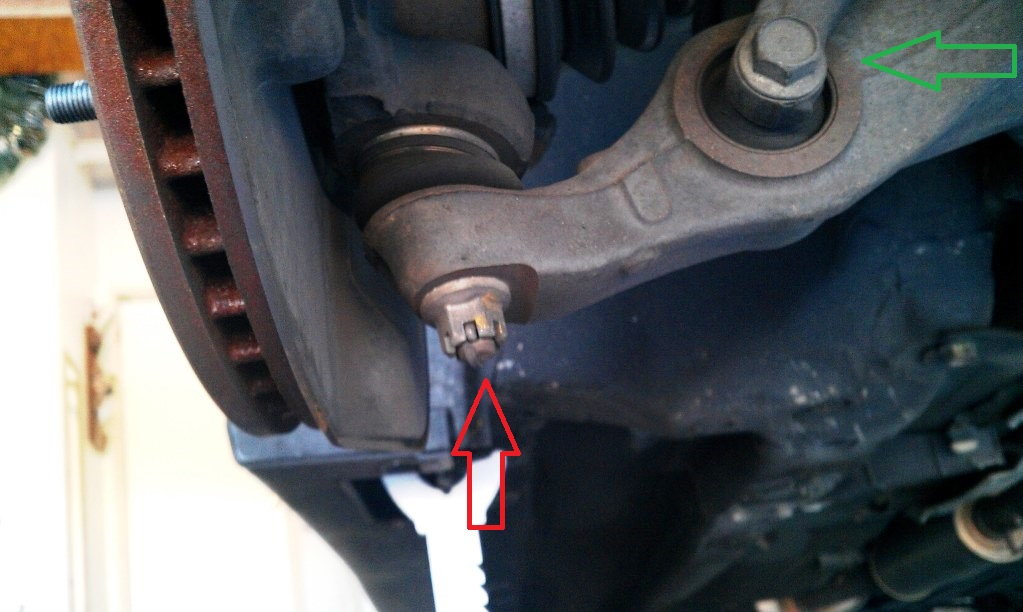 Lower ball joint (red arrow) and wishbone bolts (green arrow)