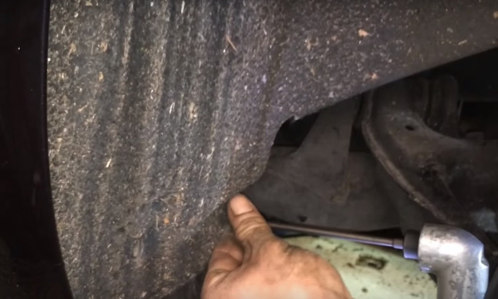 Remove the screws from the fender liner and pull it out