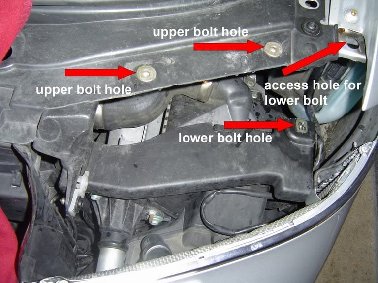 With the headlight removed, it's easier to see the lower bolt.