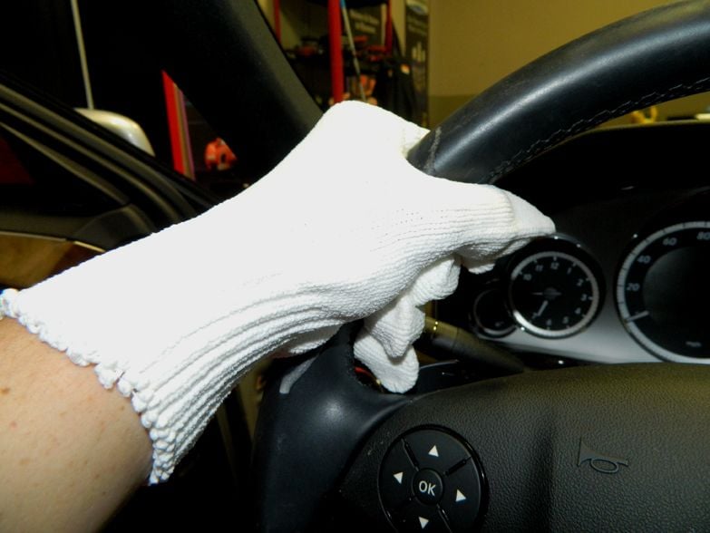 Microfiber glove cleaning steering wheel