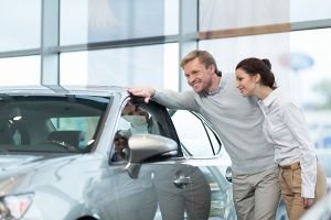 couple looking at a vehicle, car shopping