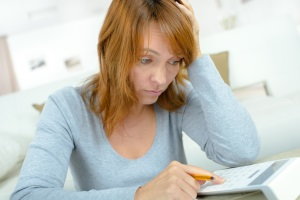 woman worried about budget, personal finance