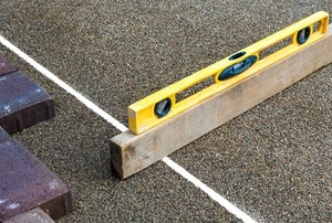 level measuring grade of ground for paver stones