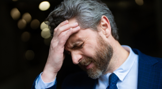 Man has headache.
