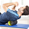image of man using foam roller.