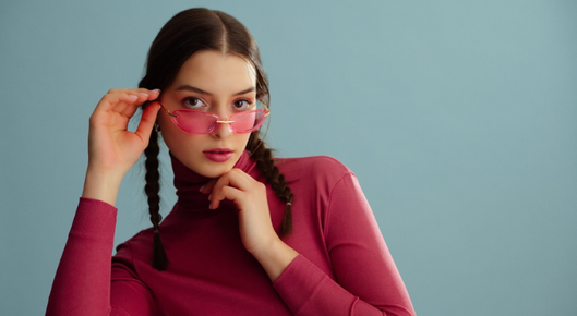 Girl wears rimless eyeglasses.