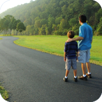 image of man and child walking together. 