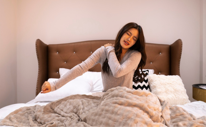 Woman wakes up stiff.