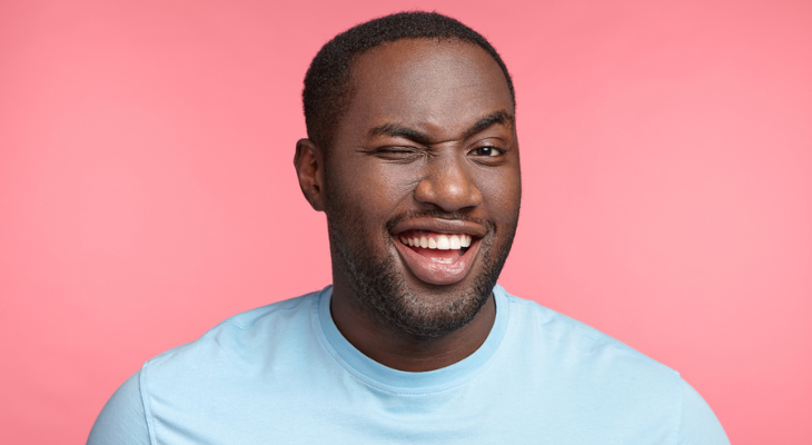 Man winks at camera.