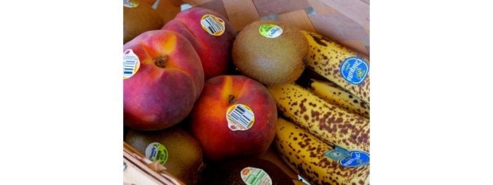 various fruits with stickers