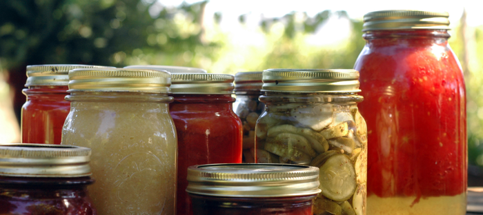 Sealed glass jars of fruit and vegetable preserves