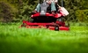 person using a riding lawn mower