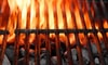 flames rising from a charcoal grill