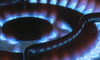 gas burner on a stove lit in the dark