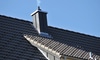 stainless steel chimney on a roof