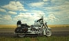 silver and black motorcycle against blue sky