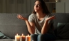 woman on couch in power outage with candles