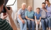 person shooting family photo of multiple generations
