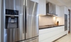 Large stainless steel refrigerator in a kitchen