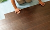 Person installing laminate flooring