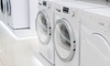 row of white washers and dryers