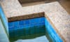 How to Repair a Pebble Pool Deck