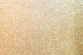 A close-up of a particle board texture.