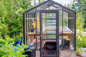 pretty greenhouse in garden