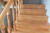 A set of completed wooden stairs with no finish.