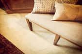Creamy tan upholstered bench and matching carpet