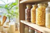 organized pantry with food goods stored in jars