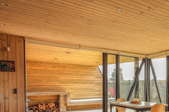 a room with wood walls and ceiling
