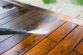 power washer cleaning deck