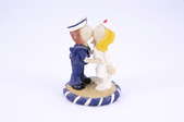 An acrylic nurse and sailor statue.