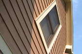 side of a house looking up into the roofline