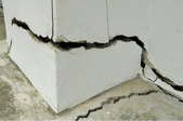 A crack in a concrete slab foundation.