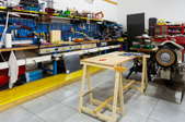 workshop with tables,tools, and power saw