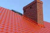 a red roof with brick chimney