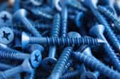 a pile of blue screws