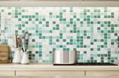 a bright green tile kitchen backsplash