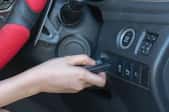 hand holding wireless key to remote engine ignition system