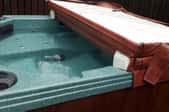 hot tub with hard cover half open