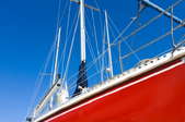 sailboat with a red hull