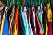 A closet stuffed with colorful clothes