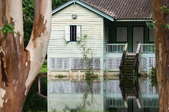 A house with a flooded yard. 