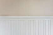 Wainscoting against a beige wall