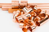 bright copper pipes with fitting connectors