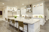 kitchen with white cabinets and marble countertops