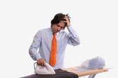 man having a difficult time ironing jacket