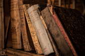several old books on a shelf